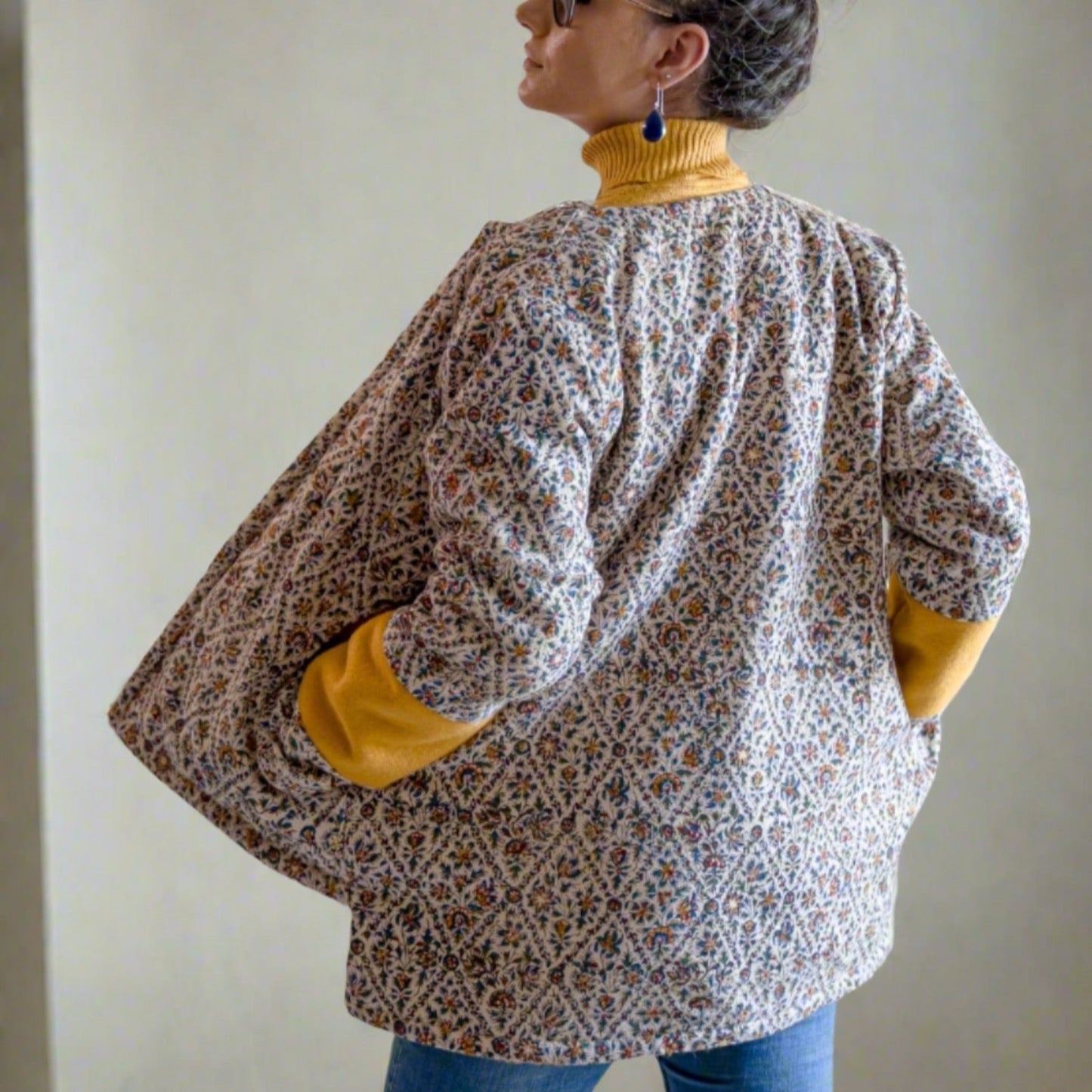 Eco-friendly Persian Garden Jacket with traditional Qalamkar floral patterns, reversible with fleece lining, for sustainable style