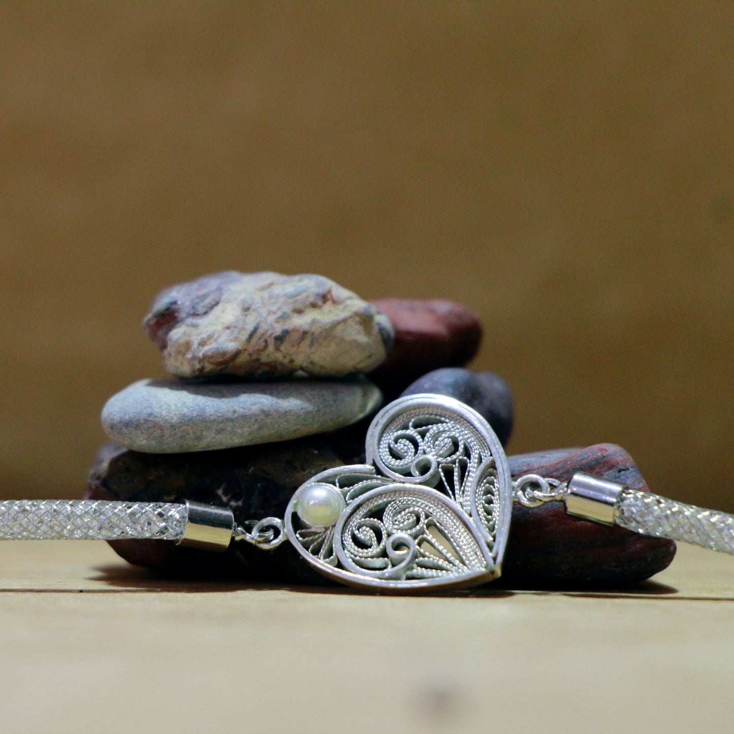 Handcrafted Persian Charm Bracelet in 999 silver with cultured pearl, a unique gift inspired by Persian artistry