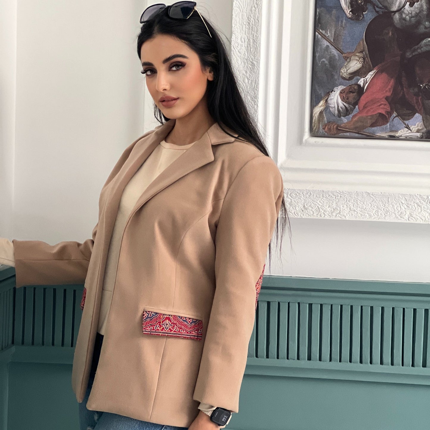 The Harmony Coat in soft felt with hand-stitched detailing, ideal for winter wear that combines comfort with artisan flair