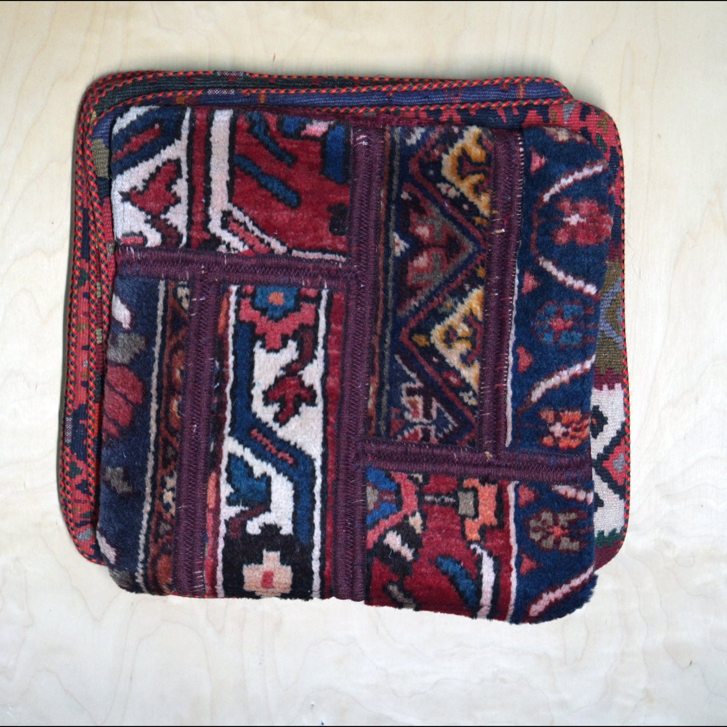 Bold and colorful Persian Gelim cushion cover, showcasing traditional Persian carpet design for cultural home decor.