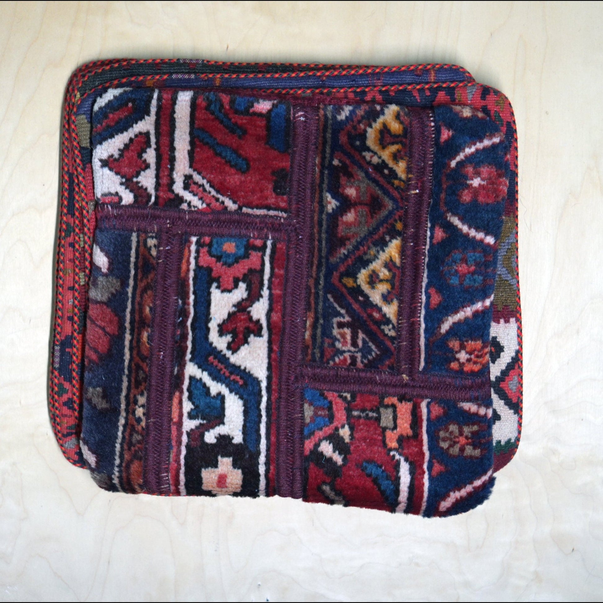 Bold and colorful Persian Gelim cushion cover, showcasing traditional Persian carpet design for cultural home decor.