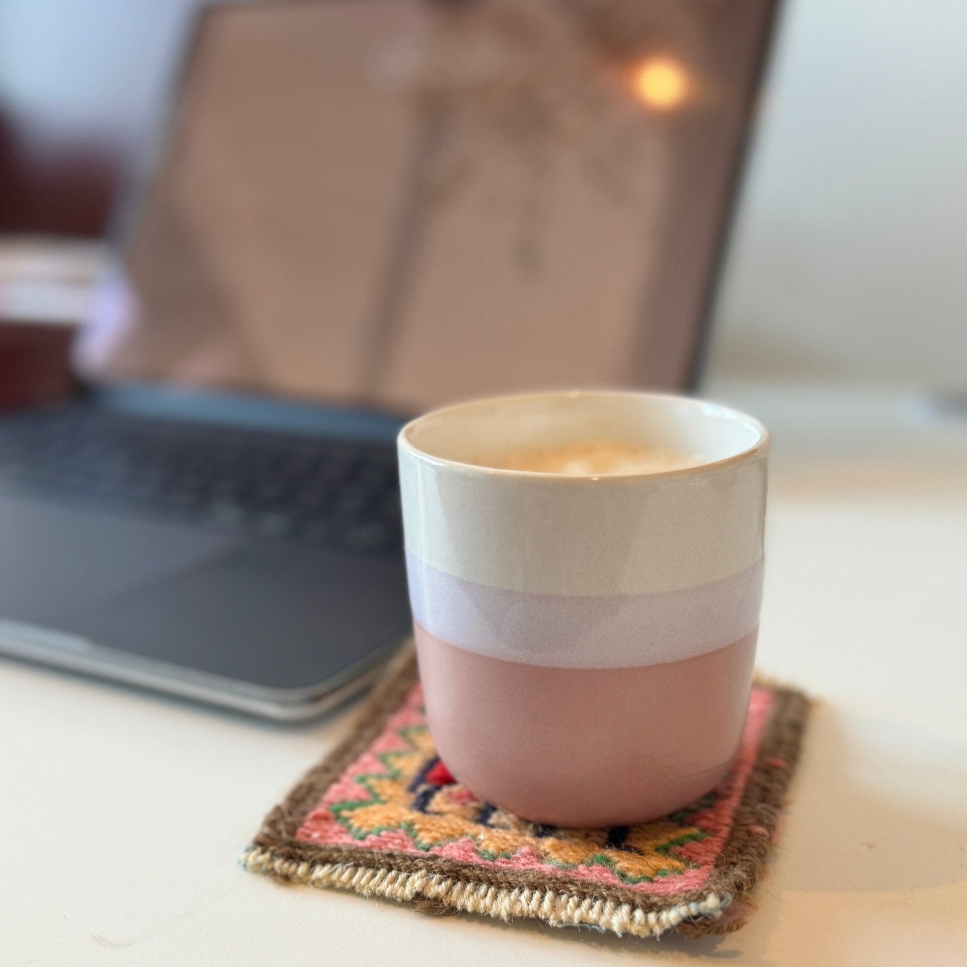 Close-up of Persian Gelim coasters, designed to protect surfaces while adding cultural charm to home decor