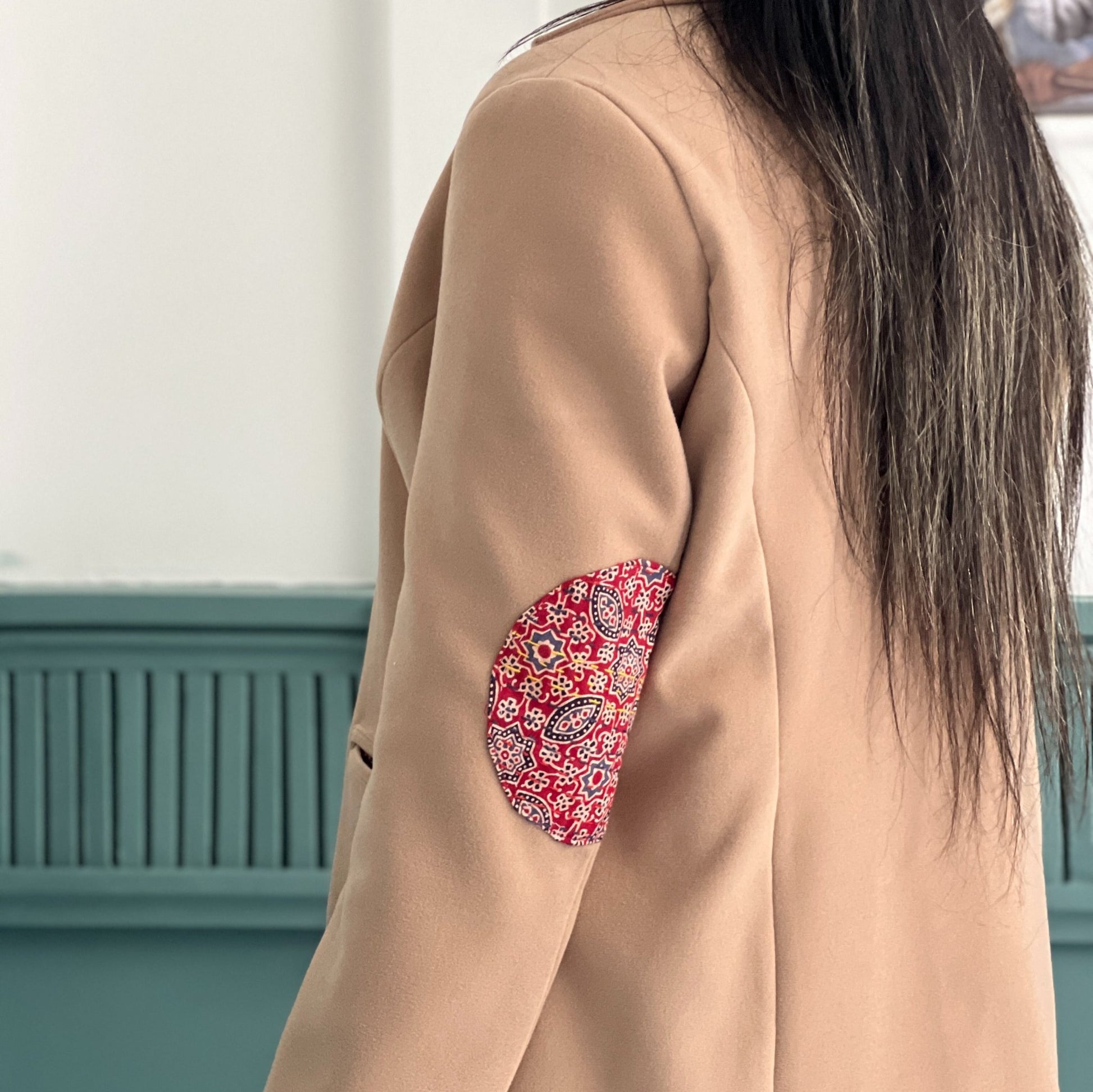 Elegant Harmony Coat crafted in felt, featuring intricate hand-stitching, blending artisan craftsmanship with winter warmth