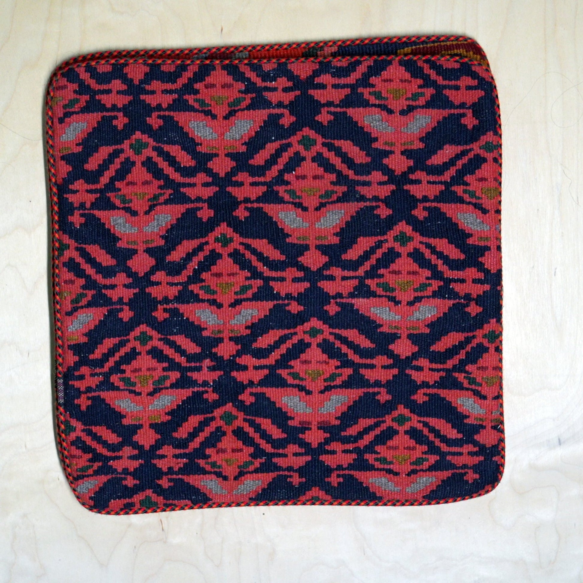 Handwoven Persian Gelim cushion cover with vibrant colors, perfect for adding festive flair and cultural charm to any room