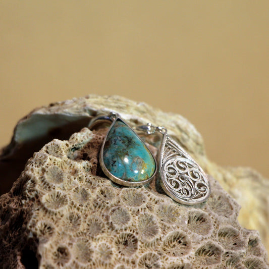 Handcrafted Malileh Earrings in 999 silver, featuring intricate Persian filigree and vibrant turquoise, a meaningful gift option
