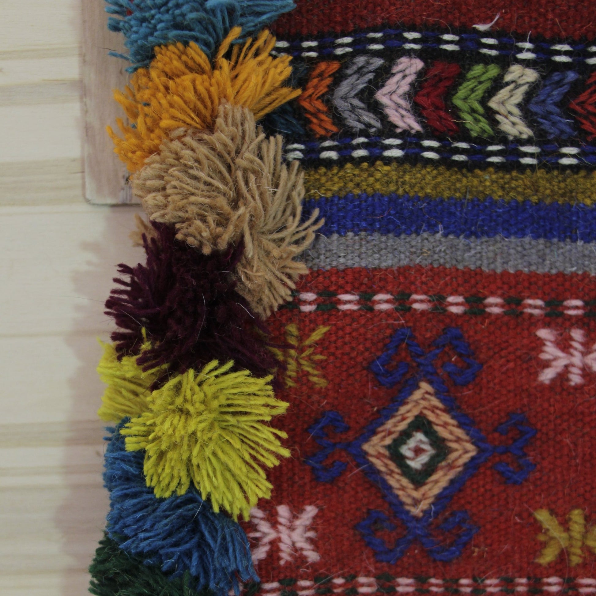 Handwoven Persian Gelim wall hanging showcasing intricate patterns, perfect for adding cultural texture to home decor
