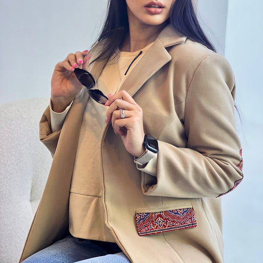 Harmony Coat crafted from premium felt with hand-stitched detailing, providing warmth and artisanal style for winter