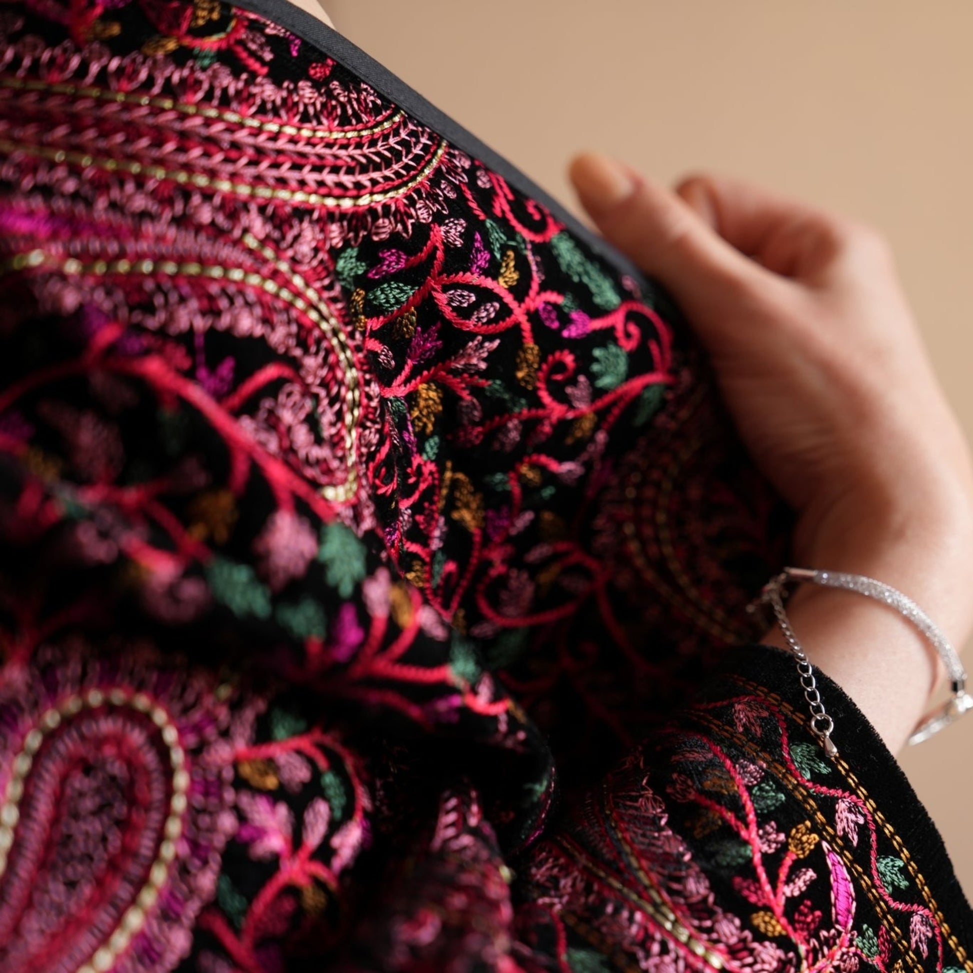 Mahnoor Jacket adorned with Persian paisley and floral patterns, creating a unique statement piece with a touch of cultural elegance.