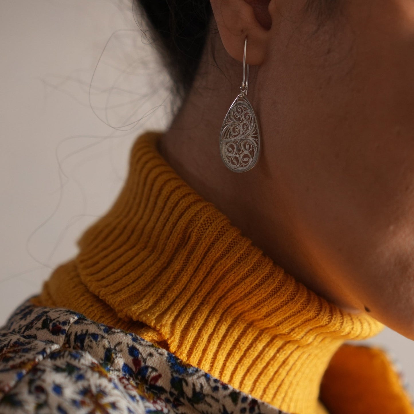 Malileh Persian Earrings crafted from 999 silver with intricate Persian patterns and lapis lazuli stones for a pop of color