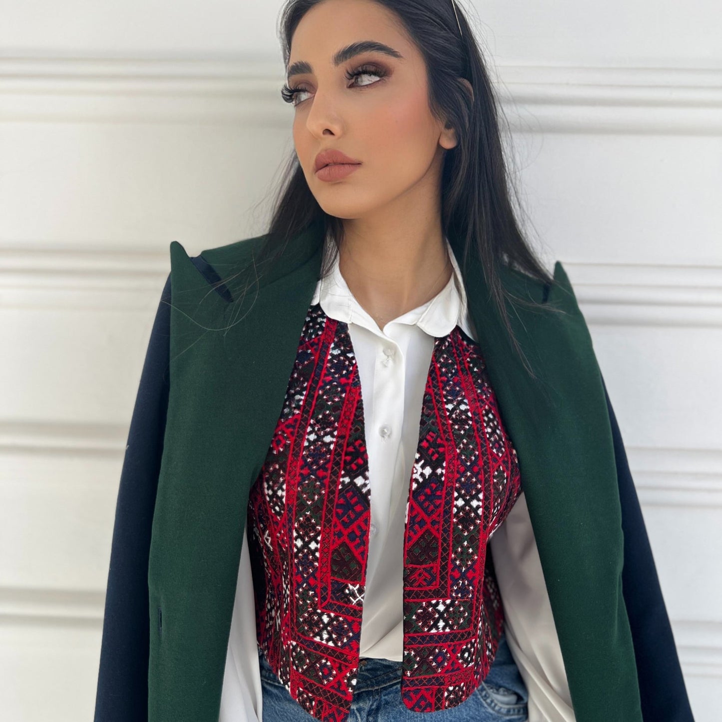 Warm Nexus Coat in navy blue with forest green accents, perfect for layering in cooler weather