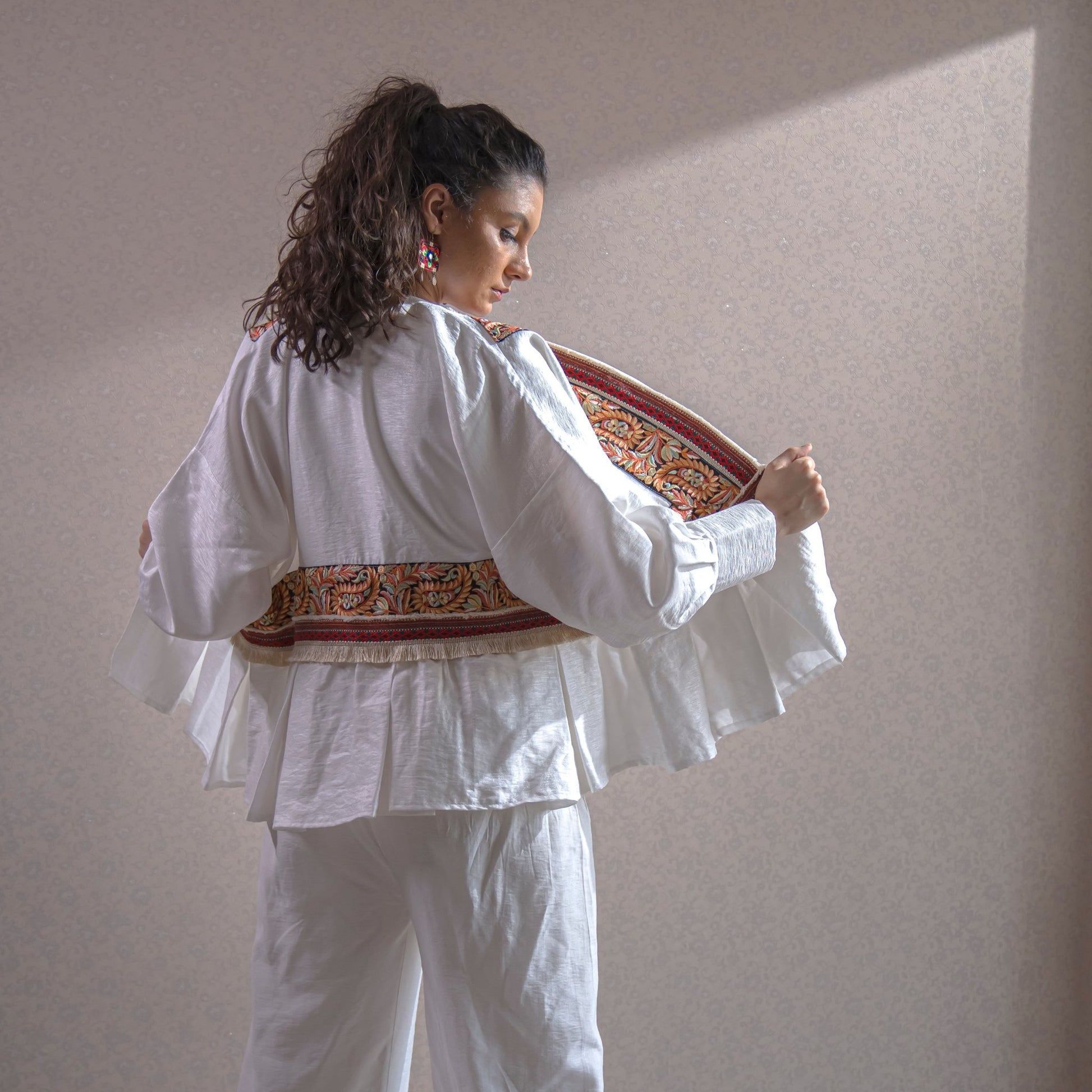 Kereshme linen garment with Persian-inspired patterns, blending cultural elegance with modern versatility