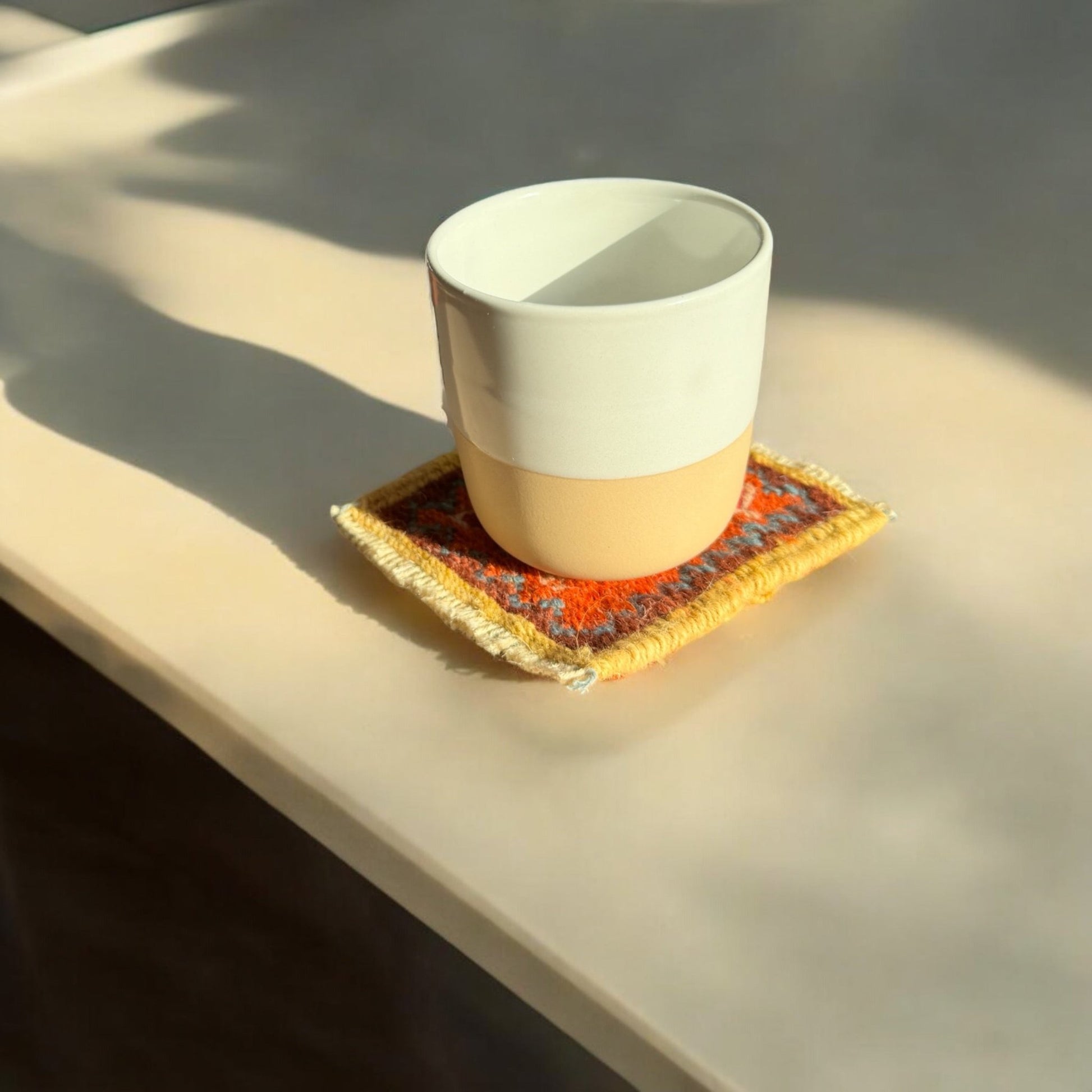 High-quality Persian Gelim coasters, available in customizable colors and patterns for a unique, artisan touch to tables